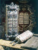 Old Hebrew Ten Commandments and scroll of the Torah.